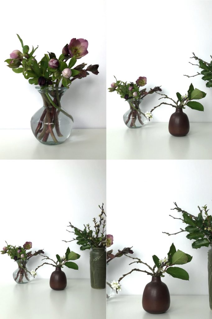 Four images showing small casual winter flower arrangements: pink hellebores in a glass vase, flowering plum branches and salal leaves in a brown bud vase, plum branches, mahonia, and huckleberry leaves in a green vase.