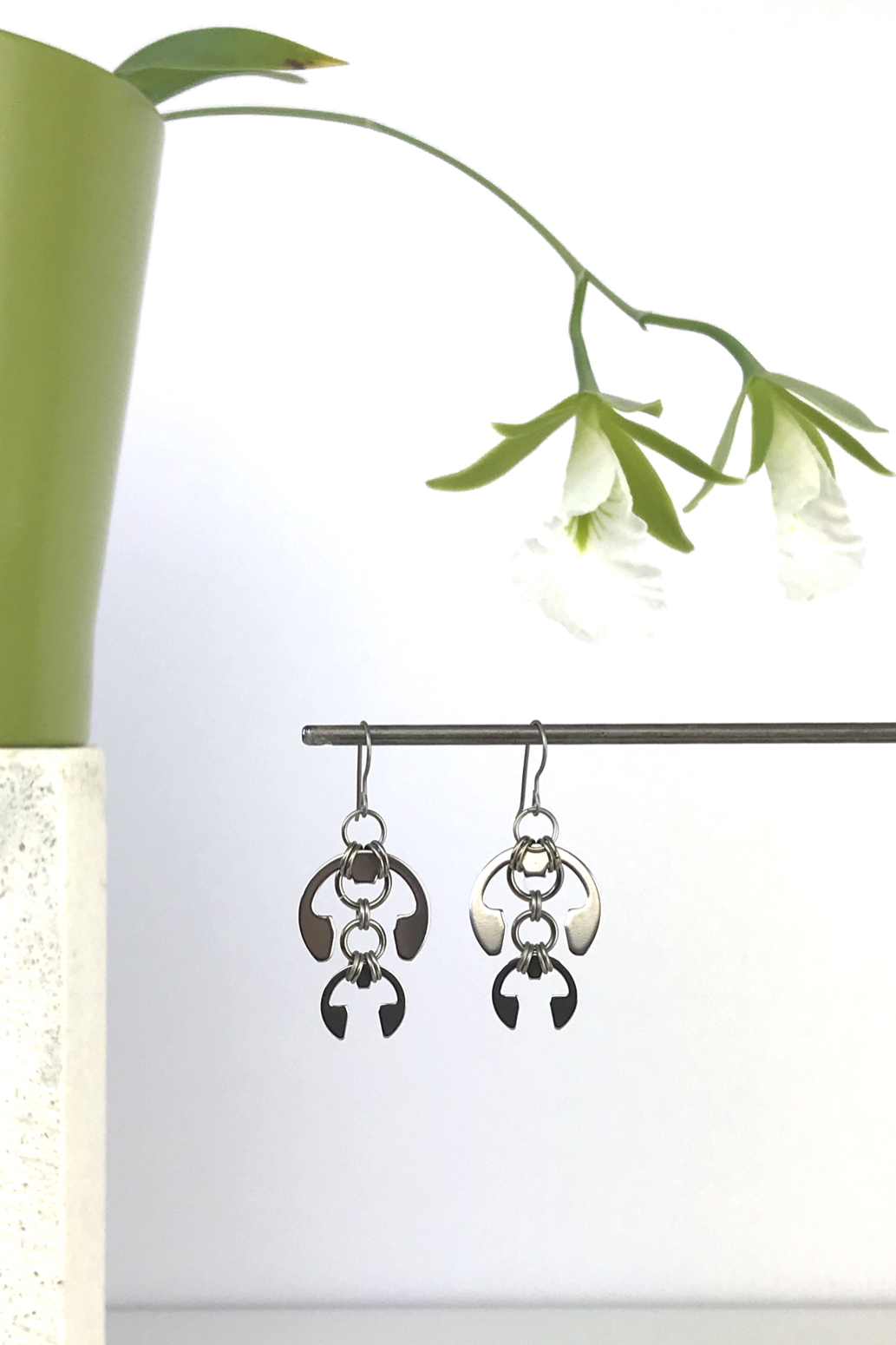 Wraptillion's Hops Earrings with blooming orchid Encyclia mariae.