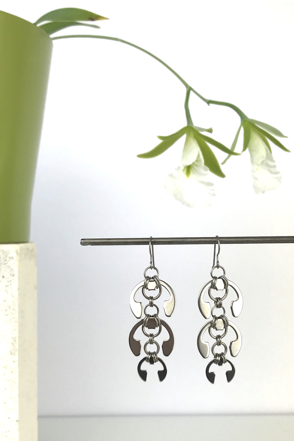 Wraptillion's Laburnum Earrings with blooming orchid Encyclia mariae.