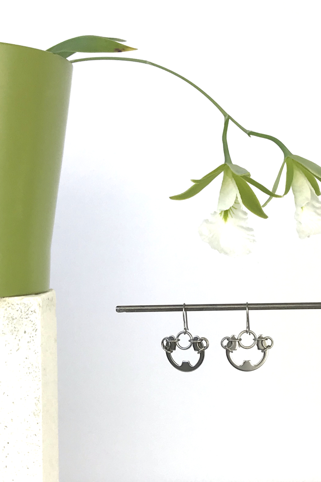 Wraptillion's Large Poppy Earrings with blooming orchid Encyclia mariae.