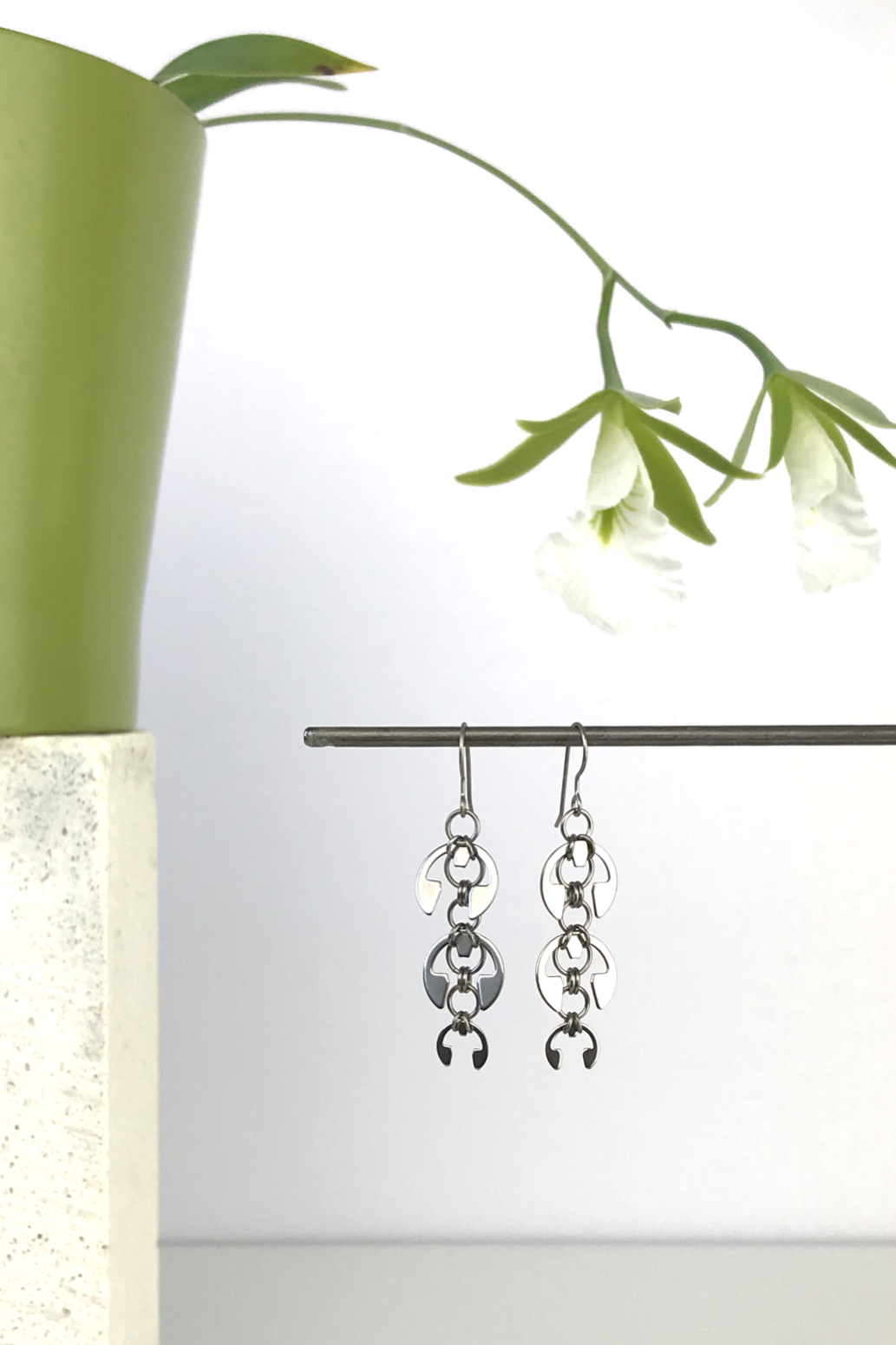 Wraptillion's Long Fuchsia Earrings with blooming orchid Encyclia mariae.