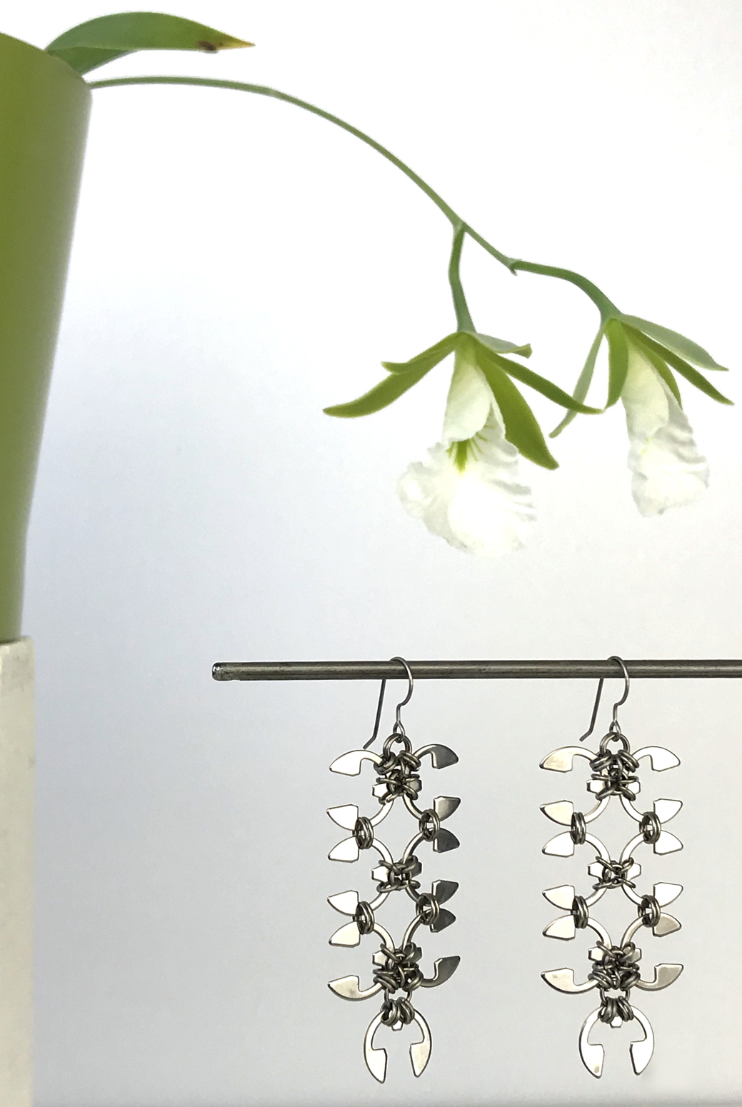 Wraptillion's Long Wisteria Earrings with blooming orchid Encyclia mariae.