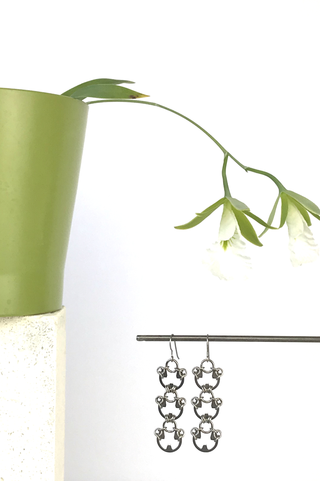 Wraptillion's Lotus Earrings with blooming orchid Encyclia mariae.