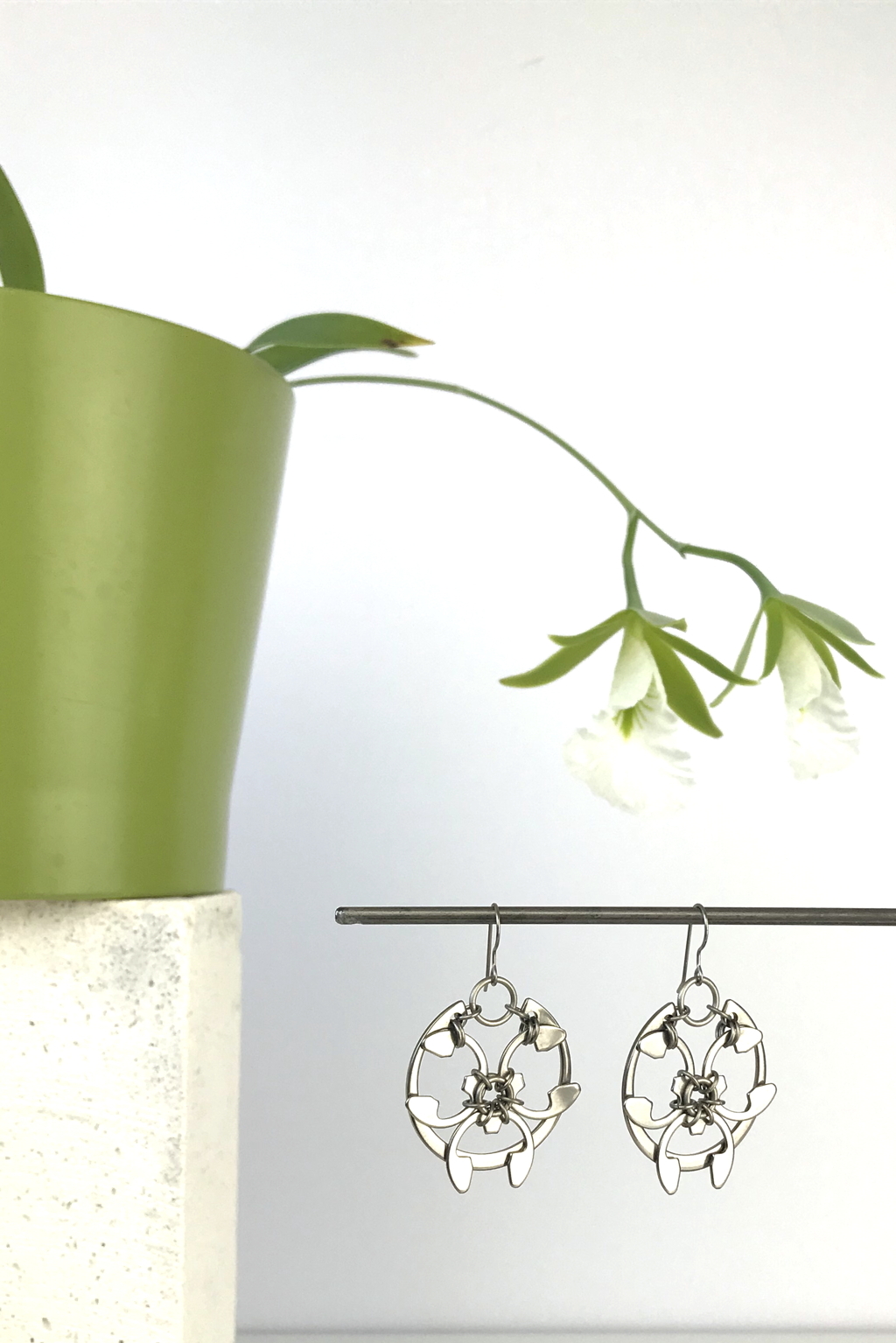 Wraptillion's Rose Window Earrings with blooming orchid Encyclia mariae.