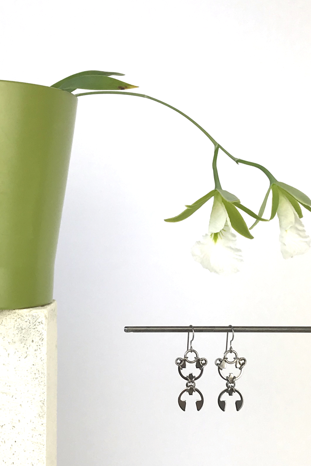 Wraptillion's Scarab Earrings with blooming orchid Encyclia mariae.