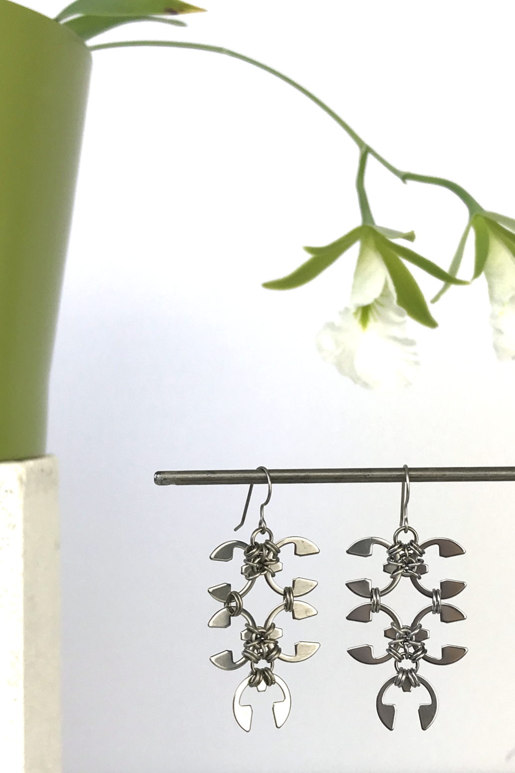 Wraptillion's Short Wisteria Earrings with blooming orchid Encyclia mariae.