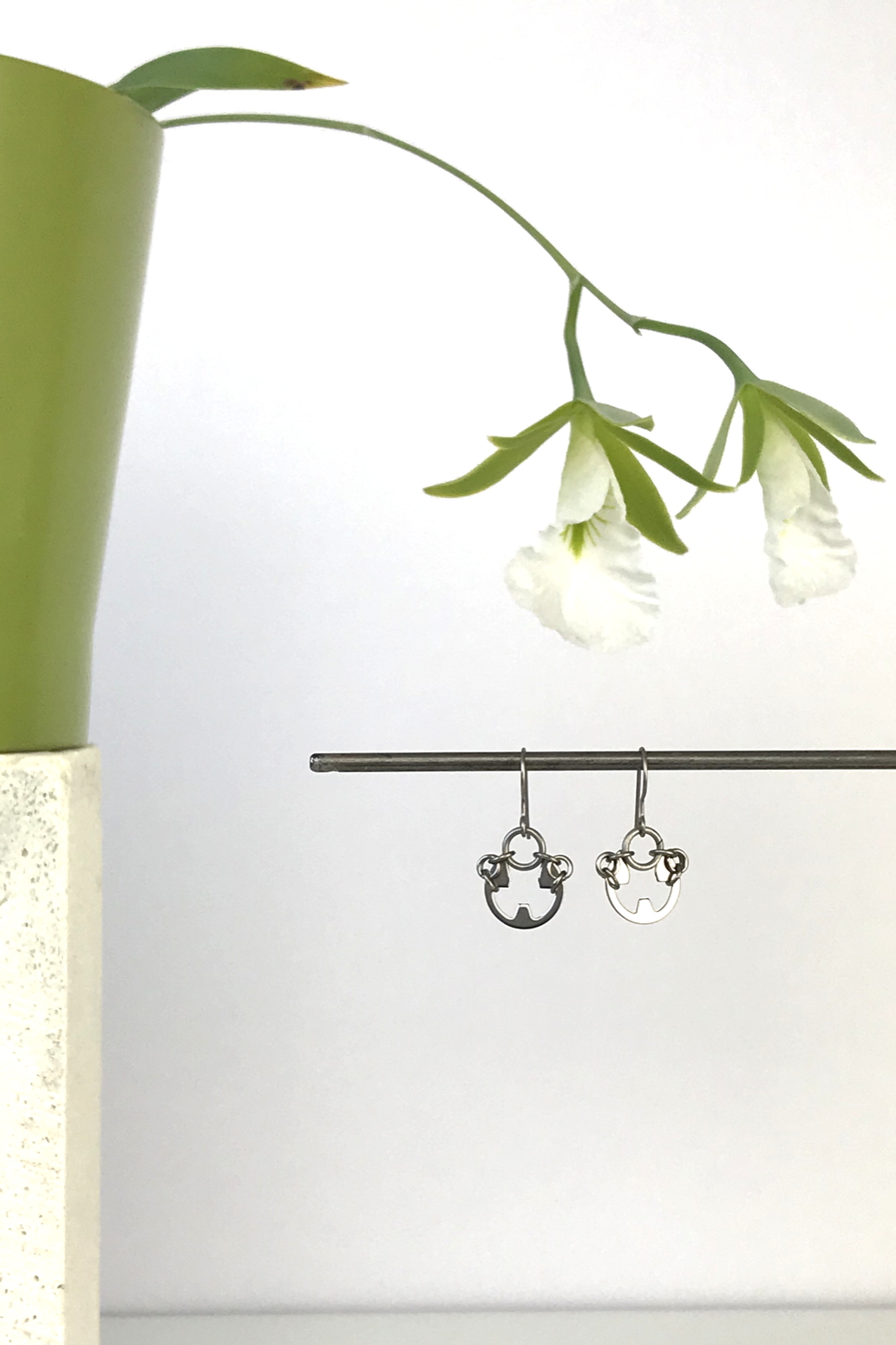 Wraptillion's Small Poppy Earrings with blooming orchid Encyclia mariae.